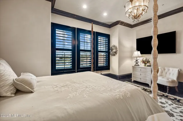 a view of a swimming pool with a table and chairs