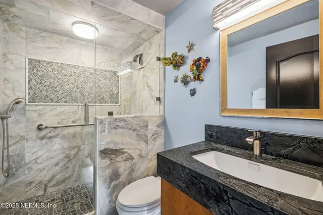 a view of a chairs and table in the backyard