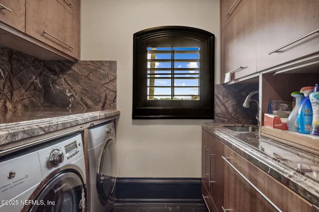 a view of a street with a building and palm trees