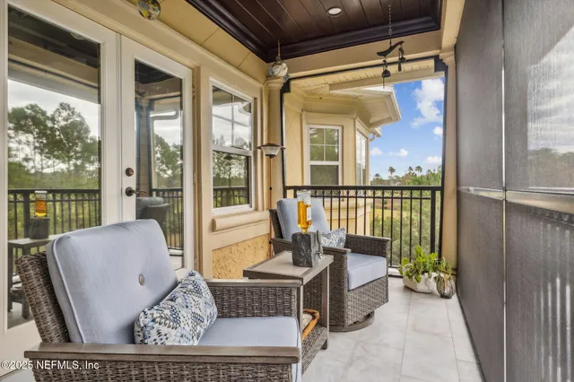 a street sign on a sidewalk next to a road