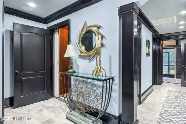 a kitchen with stainless steel appliances granite countertop a sink a stove and a wooden floors