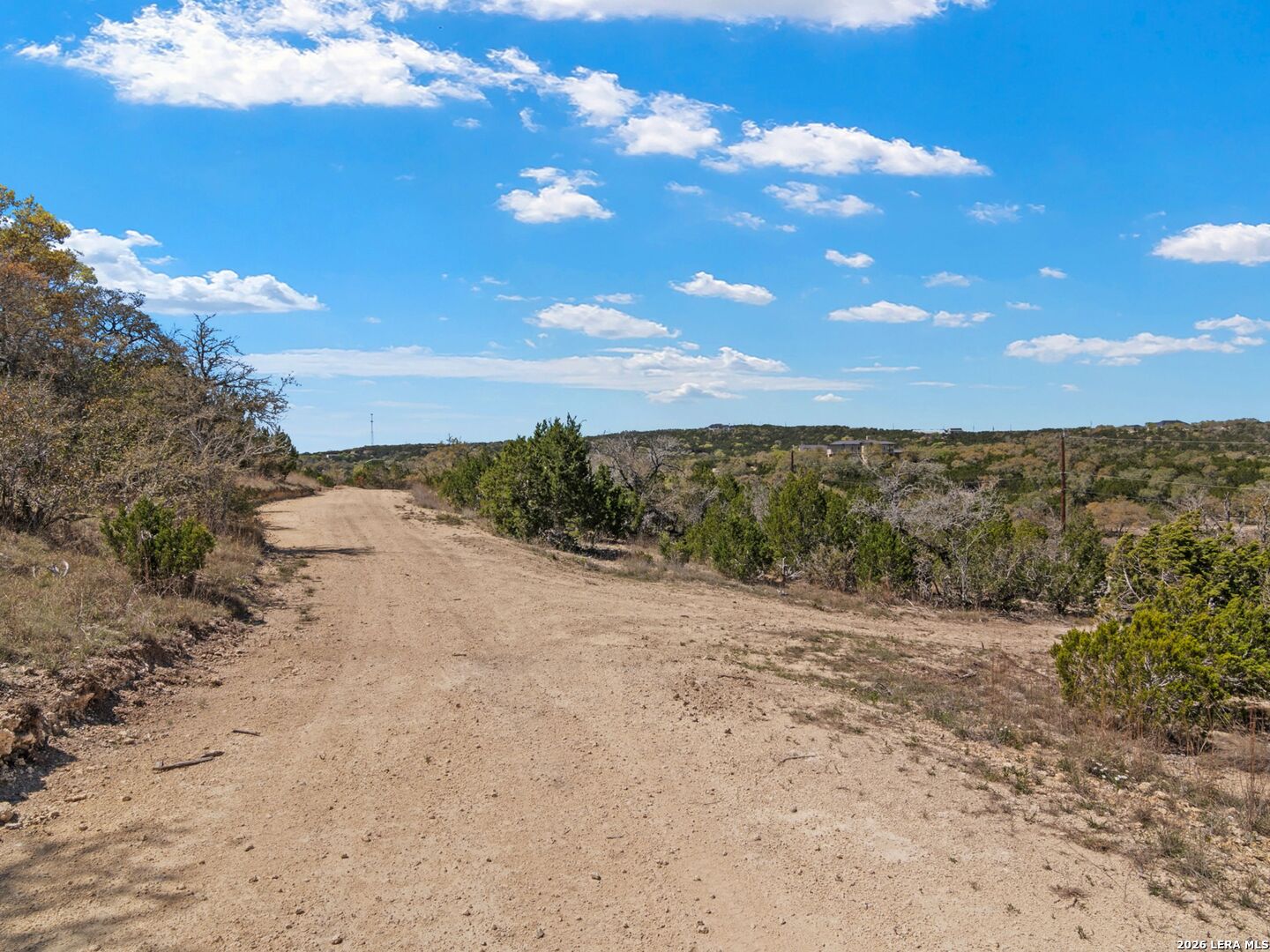 189 Table Rock Helotes, TX 78023 - Photo 46 of 91 a view of a dry yard with wooden fence