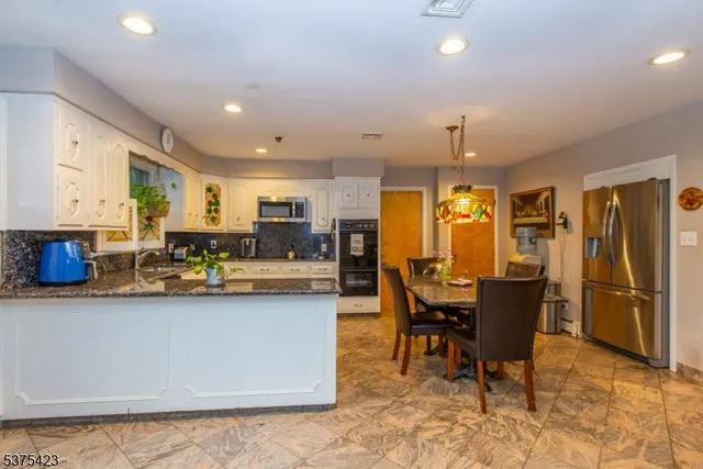 a view of a dining room with furniture