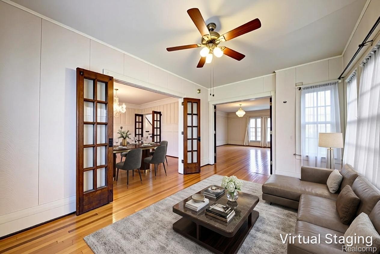 121 Longfellow Street Detroit, MI 48202 - Photo 20 of 87 Living room with a decorative wall, french doors, light wood finished floors, crown molding, and ceiling fan