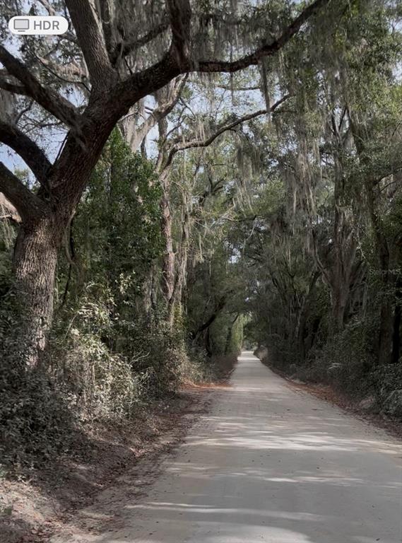 Unassigned Location Re Archer, FL 32618 - Photo 3 of 4 a view of a yard and basketball court