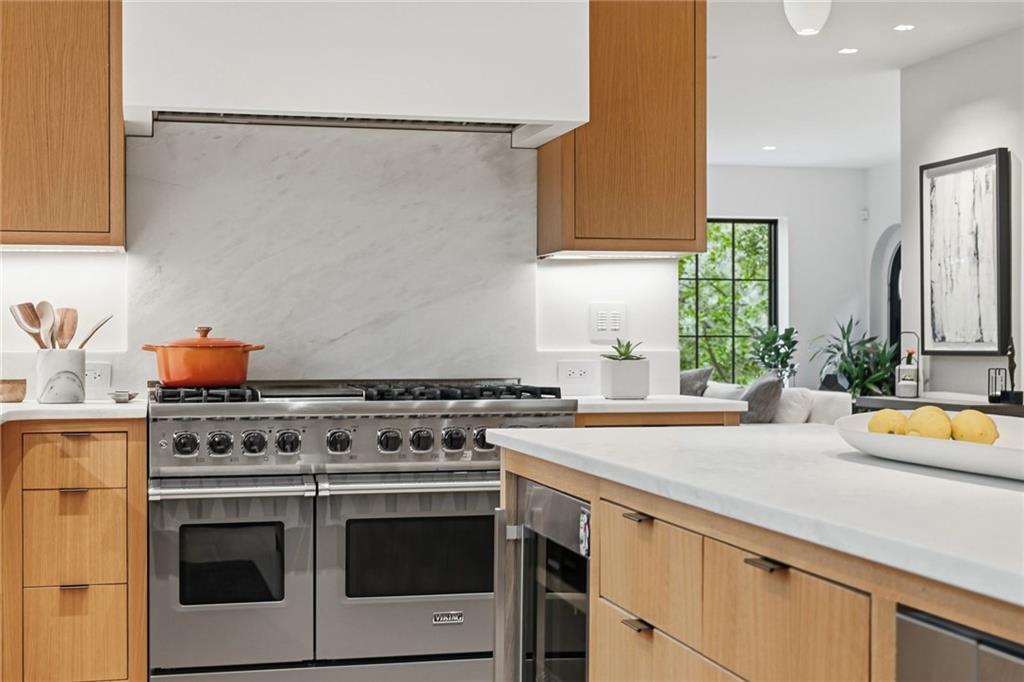 810 Persimmon Road Sewickley, PA 15143 - Photo 11 of 49 The professional Viking range, custom marble slab backsplash, and refined cabinetry reflect the kitchen's uncompromising attention to detail.