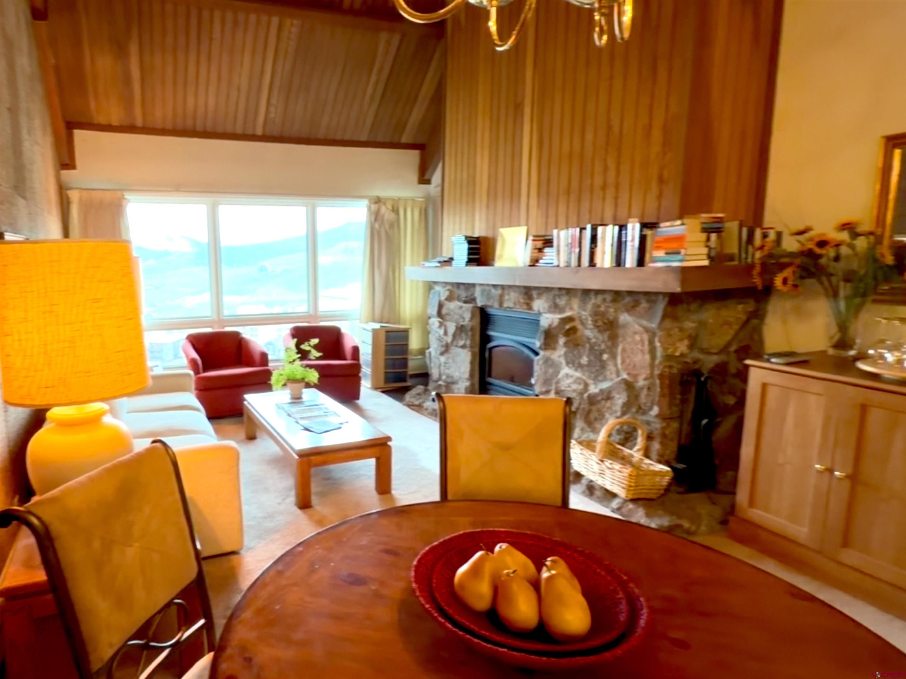 51 Whetstone Road, Unit 2306 Crested Butte, CO 81225 - Photo 11 of 44 a dining room with furniture and a window