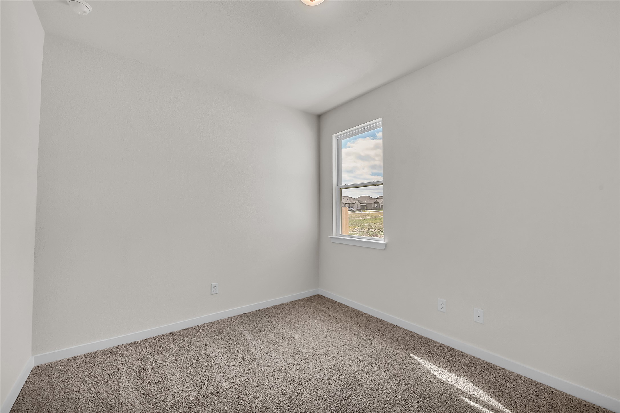 308 Boatright Boulevard Jarrell, TX 76537 - Photo 8 of 31 Empty room with baseboards and carpet