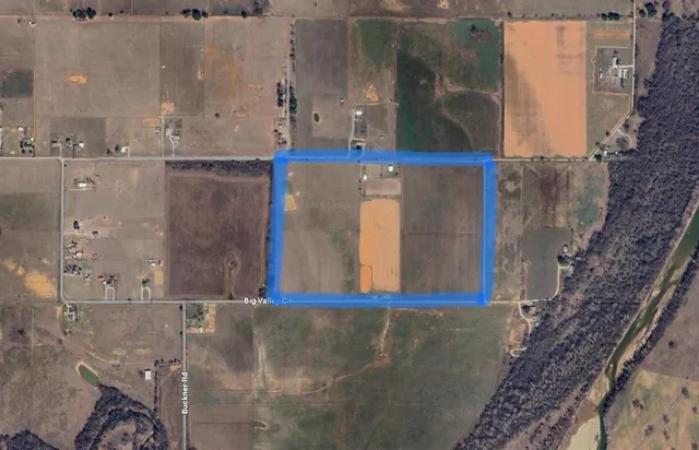 a view of a golf course with a lake