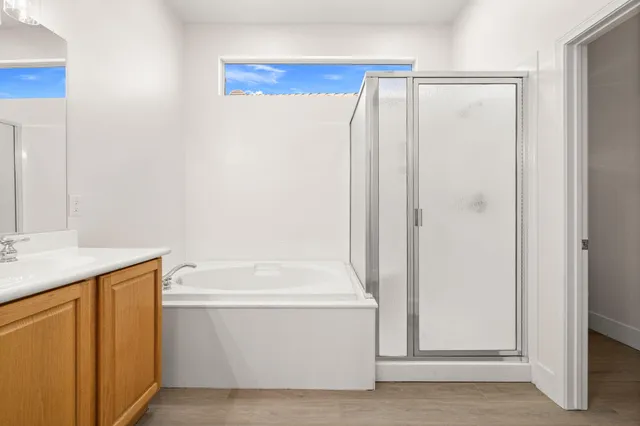a bathroom with a shower and a sink