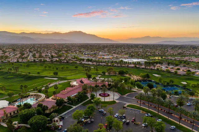 a view of a golf course with a lake view