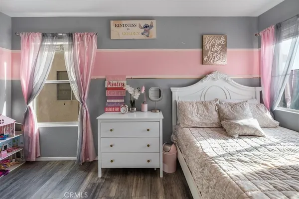 a bed room with a bed and a window