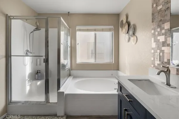 a bathroom with a bathtub and a sink