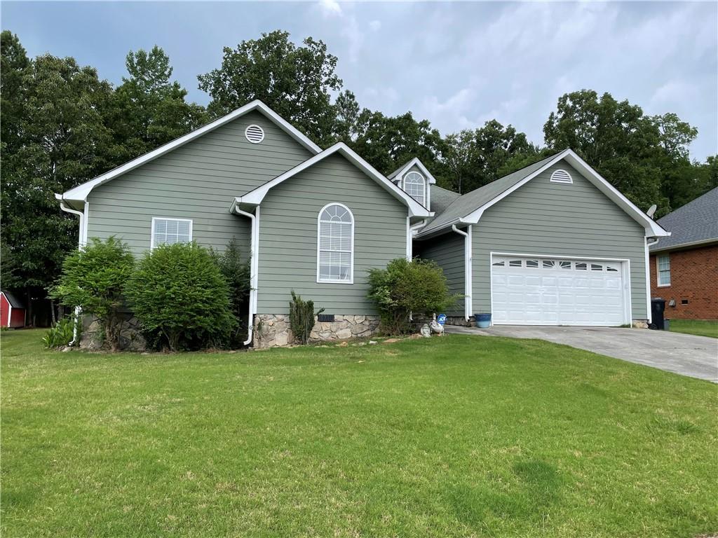 10 Limon Place Southwest Rome, GA 30165 - Photo 1 of 1 a view of a house with a yard and potted plants