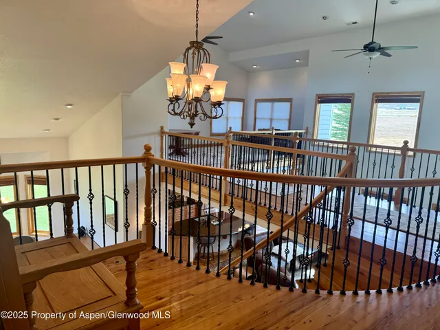 a view of a porch with wooden floor and furniture