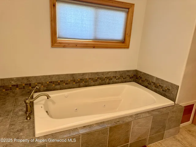 a bathroom with a bath tub