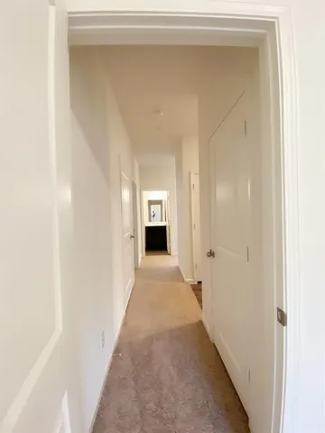 an empty room with a empty space and a window