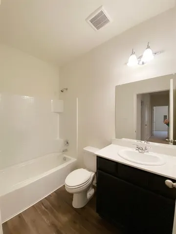 a view of a kitchen electric appliances and cabinets