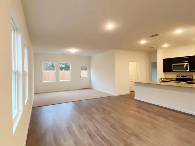 a view of an empty room and window