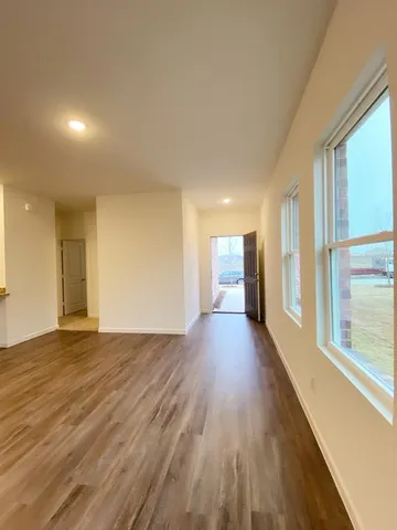 a view of kitchen with sink and microwave