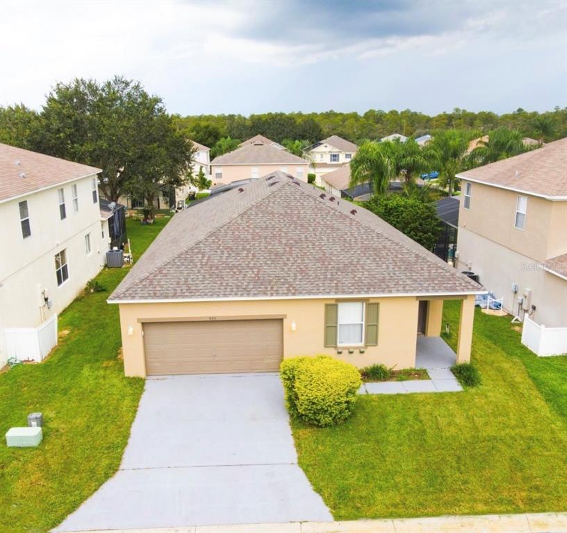 435 Kettering Road Davenport, FL 33897 - Photo 1 of 8 a front view of a house with a yard