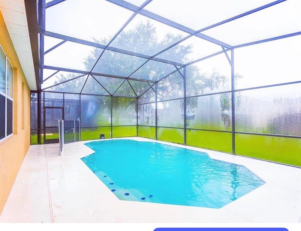 435 Kettering Road Davenport, FL 33897 - Photo 2 of 8 a view of an indoor swimming pool