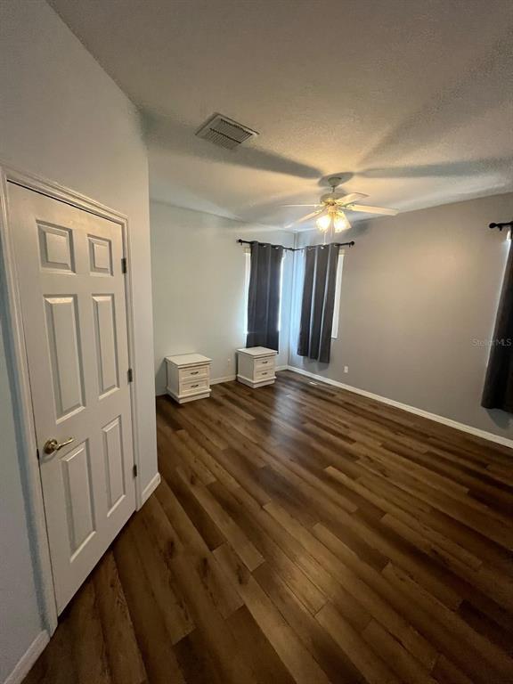 435 Kettering Road Davenport, FL 33897 - Photo 4 of 8 wooden floor in an empty room