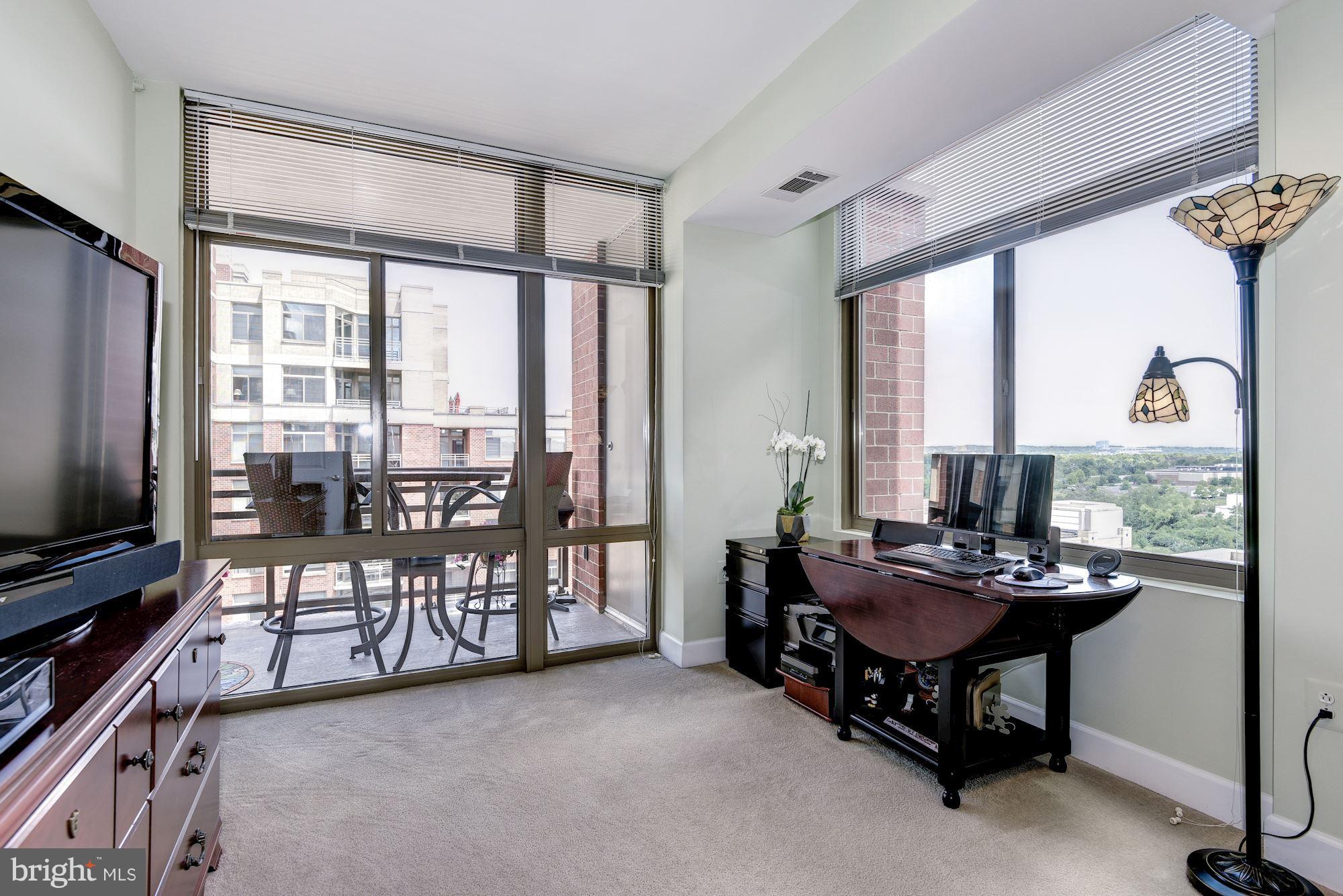 3600 South Glebe Road, Unit 918W Arlington, VA 22202 - Photo 14 of 30 a dining room with furniture water view and a floor to ceiling window
