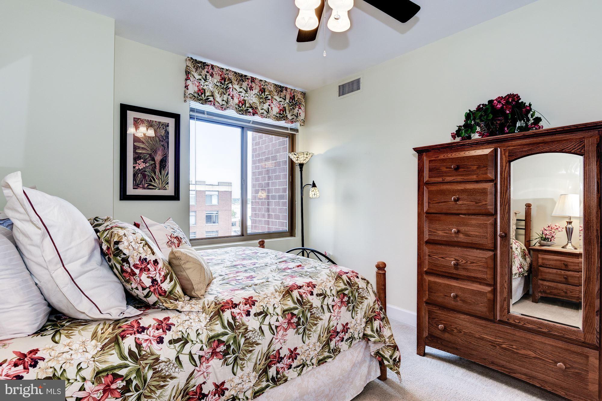3600 South Glebe Road, Unit 918W Arlington, VA 22202 - Photo 19 of 30 a bedroom with bed and wooden floor