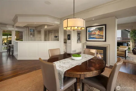 a view of a dining room with furniture wooden floor and chandelier