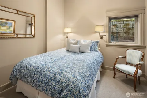 a bedroom with bed and window