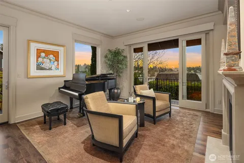 a living room with furniture and a floor to ceiling window