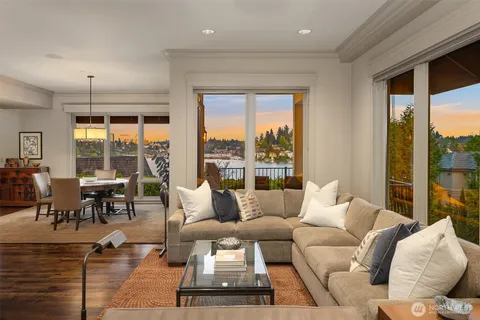 a living room with furniture and large windows