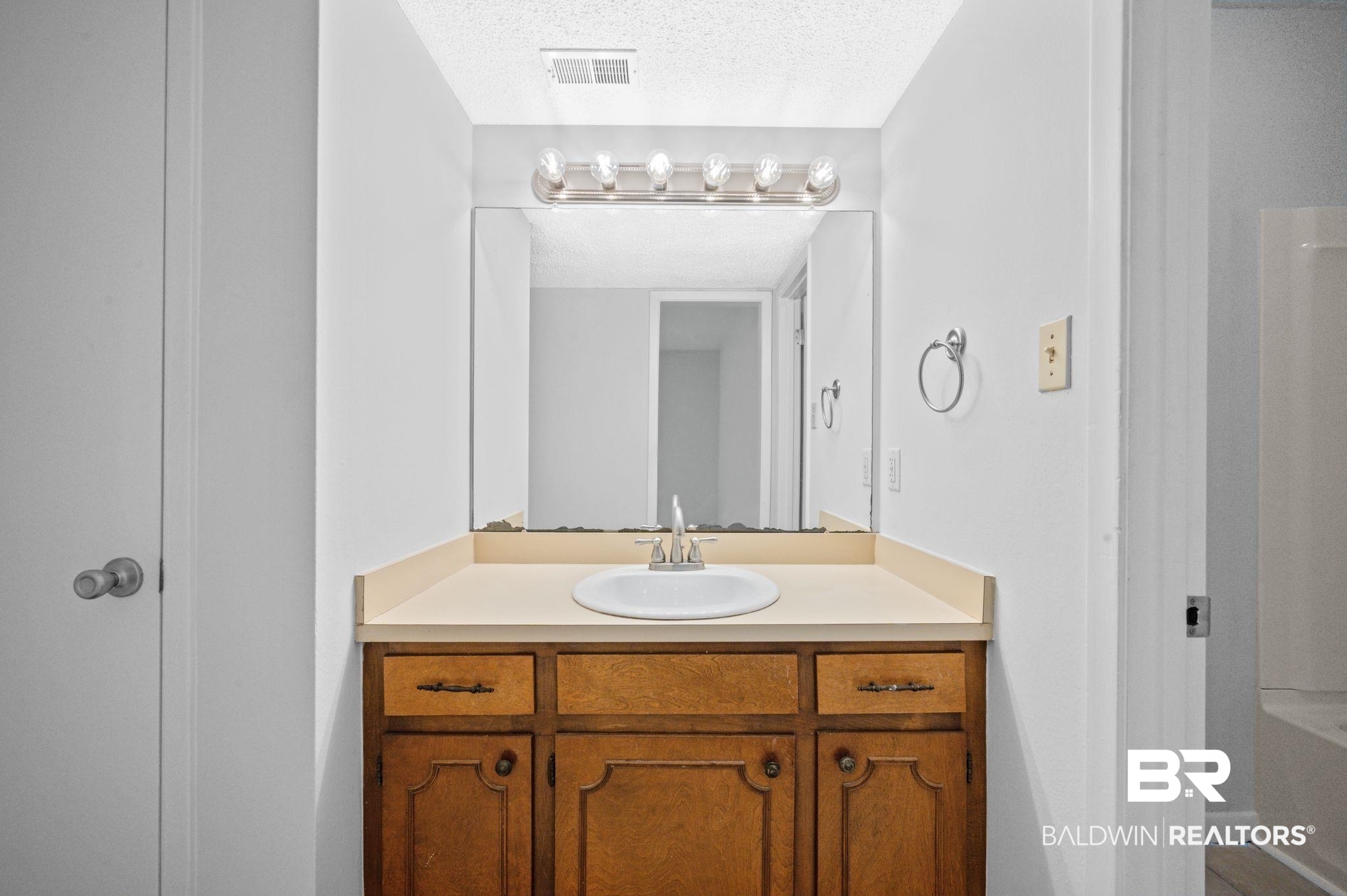 3701 Vista Ridge Drive Mobile, AL 36693 - Photo 16 of 33 Bathroom featuring a textured ceiling, plus walk in shower, and vanity