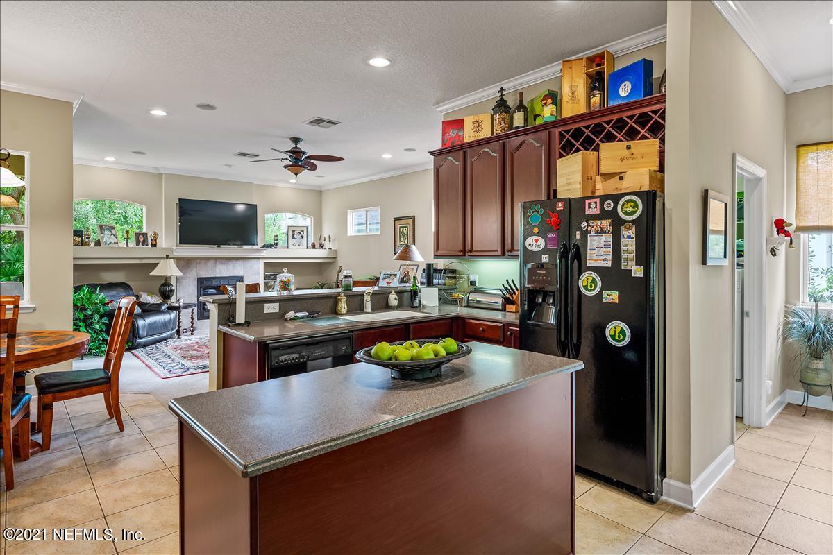 812 Riley Lane St. Augustine, FL 32095 - Photo 10 of 35 a kitchen with stainless steel appliances granite countertop a refrigerator and a stove top oven