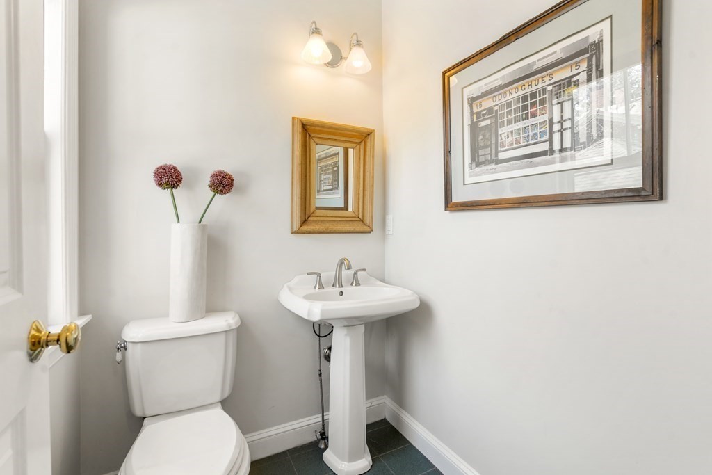19 Elmore Street Newton, MA 02459 - Photo 13 of 40 a bathroom with a sink mirror and toilet