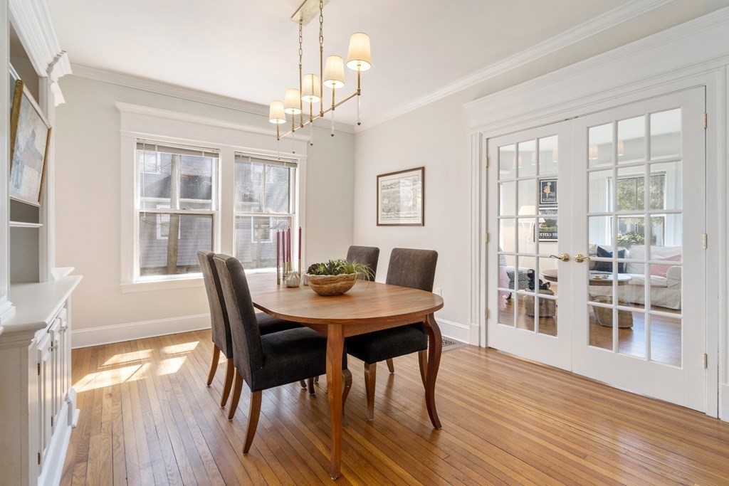 19 Elmore Street Newton, MA 02459 - Photo 14 of 40 a view of a dining room with furniture wooden floor and chandelier