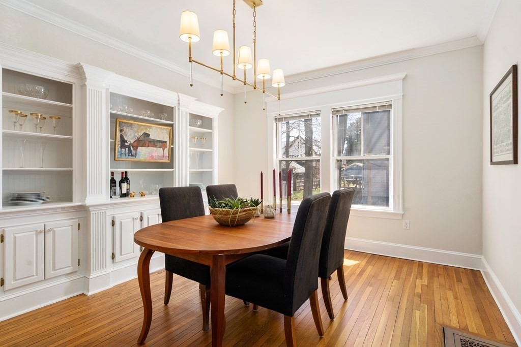 19 Elmore Street Newton, MA 02459 - Photo 16 of 40 a view of a dining room with furniture window and wooden floor