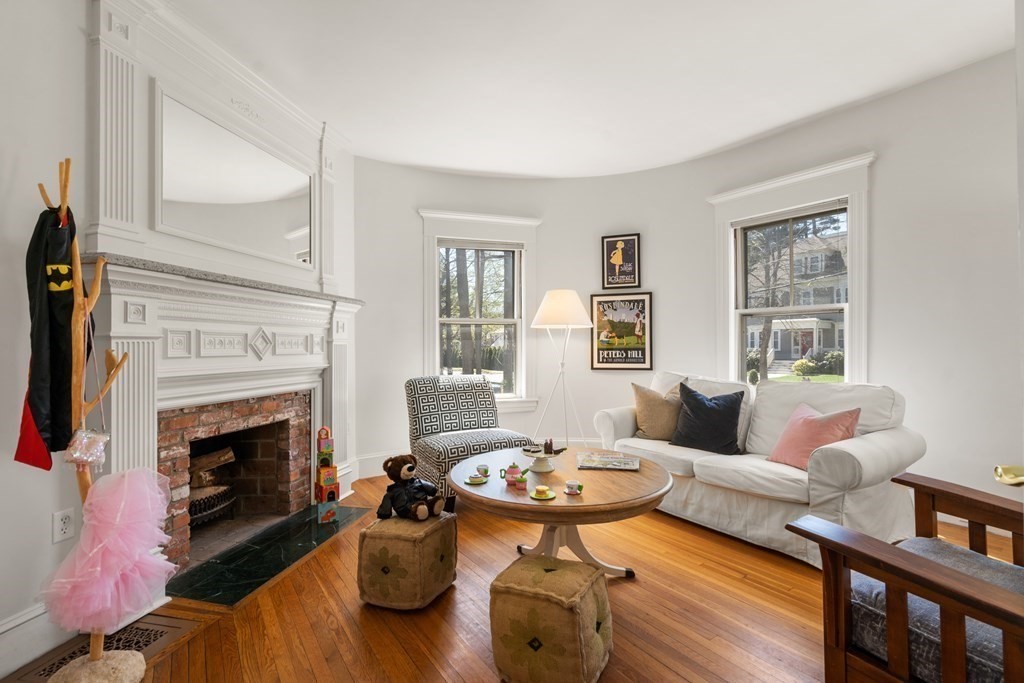 19 Elmore Street Newton, MA 02459 - Photo 17 of 40 a living room with furniture and a fireplace