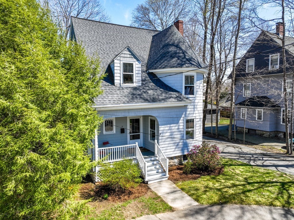 19 Elmore Street Newton, MA 02459 - Photo 2 of 40 a front view of a house with garden