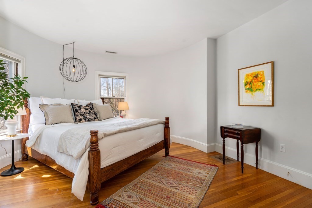 19 Elmore Street Newton, MA 02459 - Photo 21 of 40 a bedroom with bed and a table