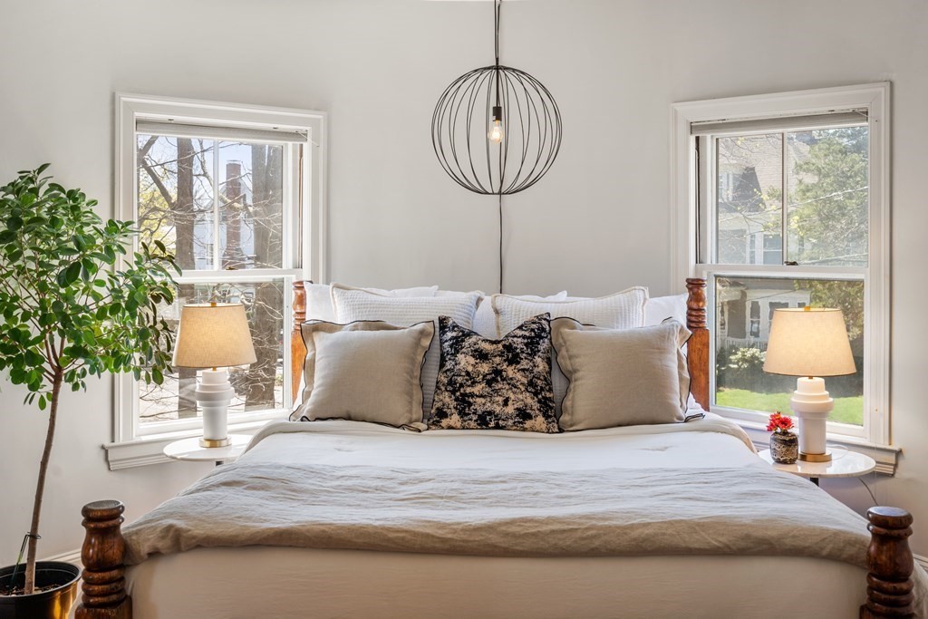 19 Elmore Street Newton, MA 02459 - Photo 22 of 40 a bed room with a bed and a chandelier