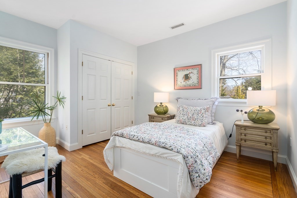 19 Elmore Street Newton, MA 02459 - Photo 28 of 40 a bedroom with a bed and furniture