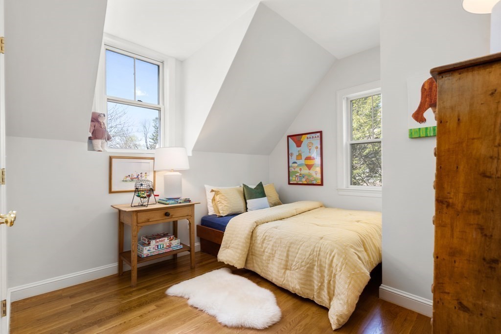 19 Elmore Street Newton, MA 02459 - Photo 29 of 40 a bedroom with a bed and wooden floor