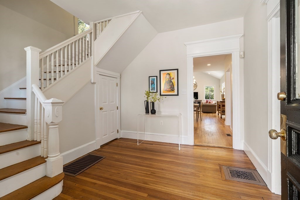 19 Elmore Street Newton, MA 02459 - Photo 3 of 40 a view of a hallway view with wooden floor and staircase