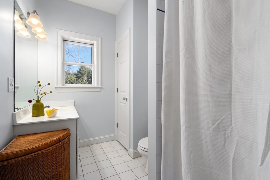 19 Elmore Street Newton, MA 02459 - Photo 31 of 40 a bathroom with a sink and a window