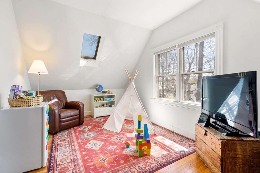 19 Elmore Street Newton, MA 02459 - Photo 33 of 40 a living room with furniture and a flat screen tv