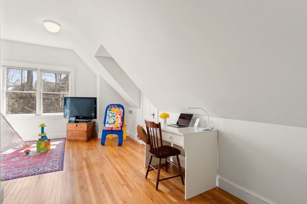 19 Elmore Street Newton, MA 02459 - Photo 34 of 40 a living room with furniture and a flat screen tv