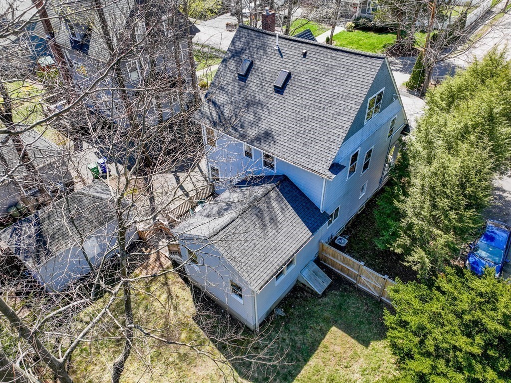 19 Elmore Street Newton, MA 02459 - Photo 38 of 40 a view of a wooden house with a small yard and large trees