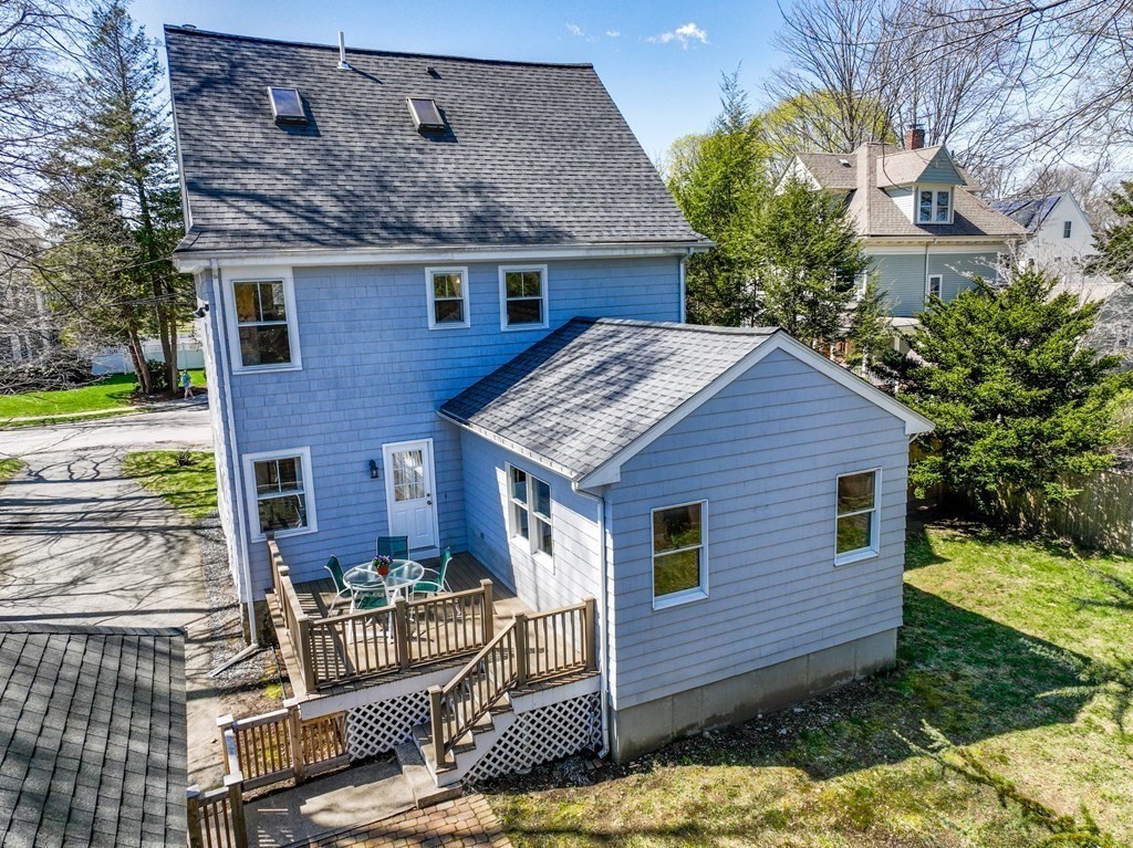 19 Elmore Street Newton, MA 02459 - Photo 40 of 40 a backyard of a house with yard and outdoor seating